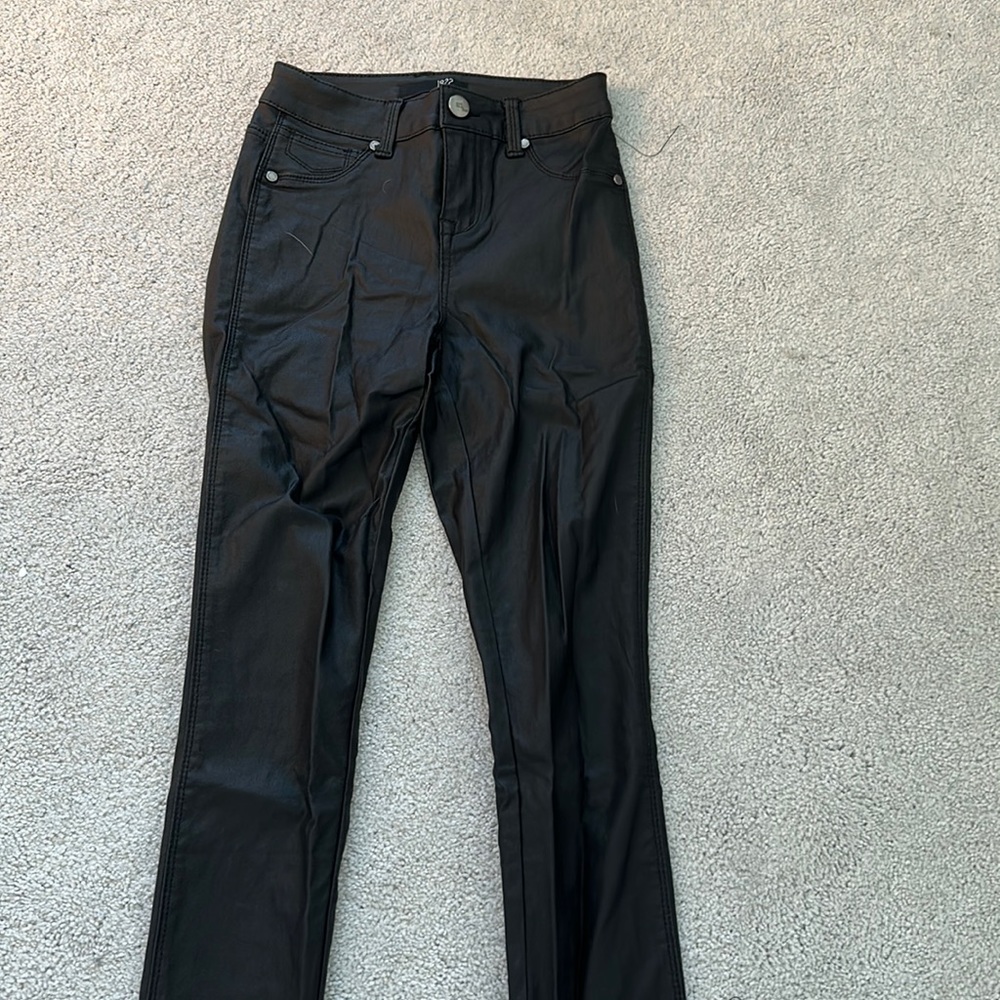 Coated black skinny jeans
